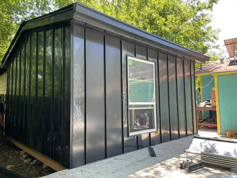 Black standing seam metal wall panels for Roof Inspection in Roswell